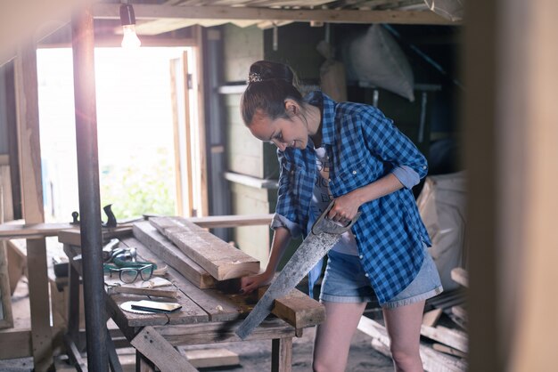 CARPINTERIA JM LOPEZ LOPEZ -  - woman engaged processing wood home workshop carpentry